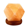Hand-cut faceted Himalayan salt diamond lamp on a wooden base