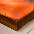 Pair of warming Himalayan salt foot tiles glowing warm