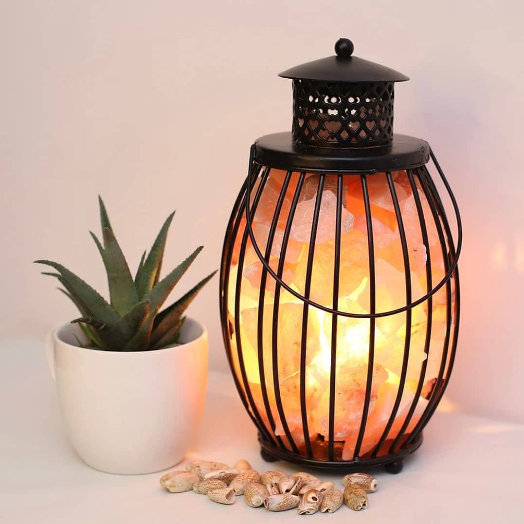 Lantern-shaped metal Himalayan salt lamp with glowing chunks