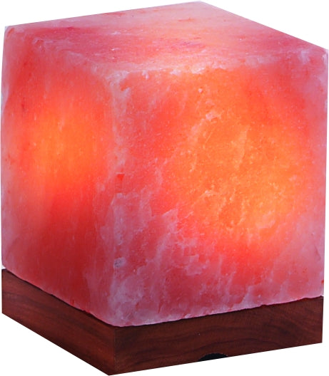 Hand-cut Himalayan salt rectangle lamp glowing warm